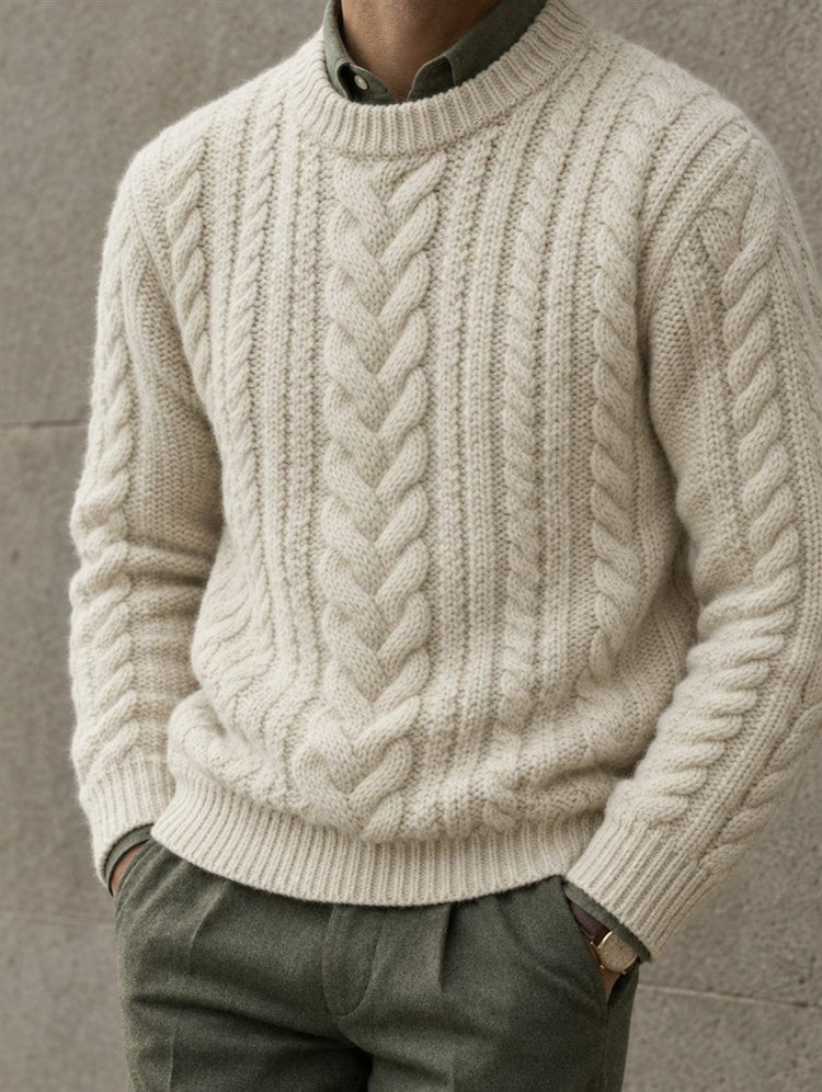 Man wearing a cream cable-knit sweater