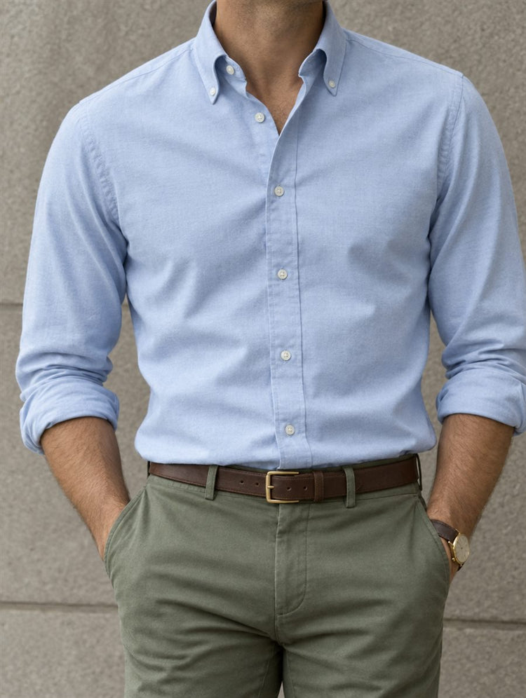 Man wearing a light blue oxford shirt